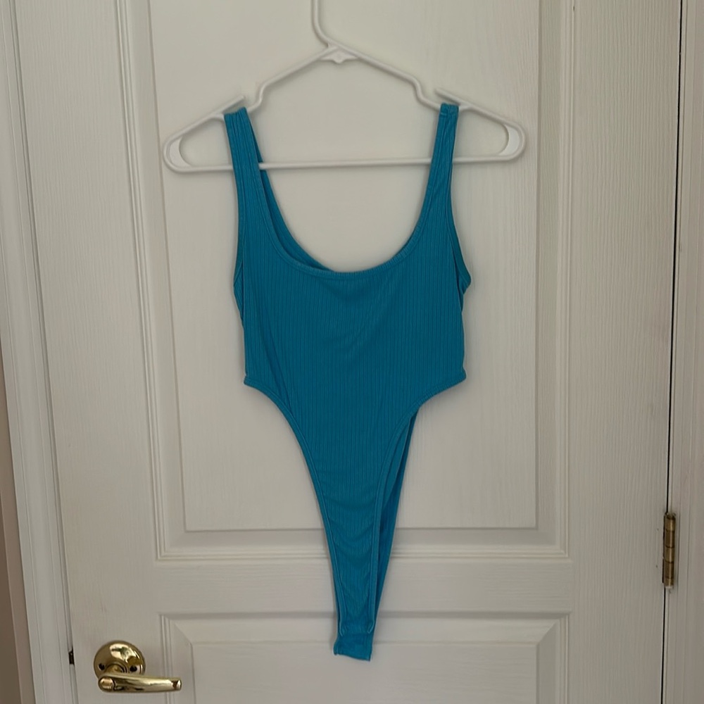 Body suit with side cut outs